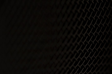 closeup macro of microphone dark black texture