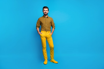 Sticker - Full size photo of content candid guy enjoy spring free time holiday put hands pocket wear stylish colorful outfit footwear isolated over vibrant color background