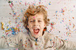 © PHILIPPE DEGROOTE/ADDICTIVE STOCK - Beautiful boy with face covered in confetti