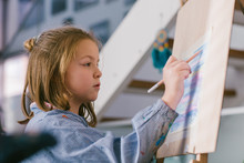 Child Drawing On Canvas