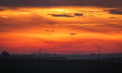 Wall Mural - sunset with red light and clouds