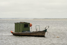 Old Green Fishing Boat With Orange Floats