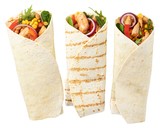Fototapeta  - Tortilla wrap with fried chicken meat and vegetables isolated on white background
