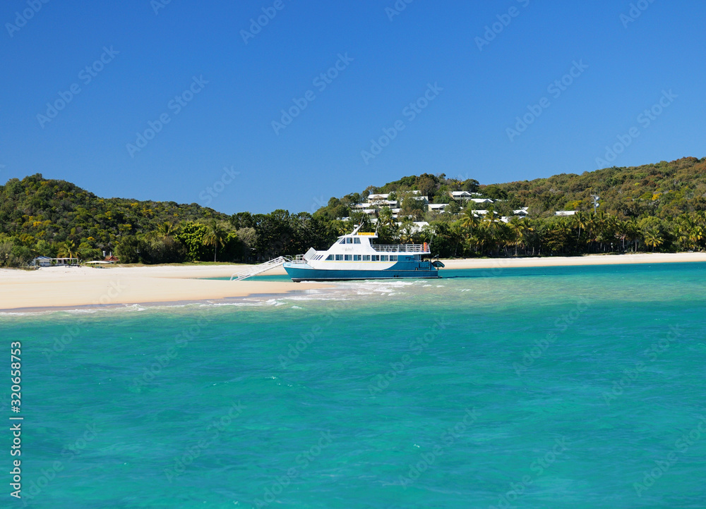 Boat In The Turquoise Water Of The Tropical Bay Of Great Keppel Island Queensland Australia - obrazy, fototapety, plakaty 