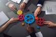 © alphaspirit - Business team connect pieces of gears. Teamwork, partnership and integration concept