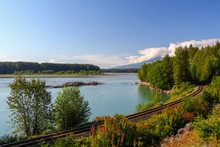 Railroad Next To Beautiful Skeena River In British Columbia / Canada