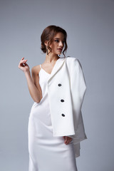 Wall Mural - Beautiful sexy woman makeup wear fashion summer collection clothes style party office dress code wedding jacket slim body pretty face model accessory jewelry brunette hair jewelry white bride.
