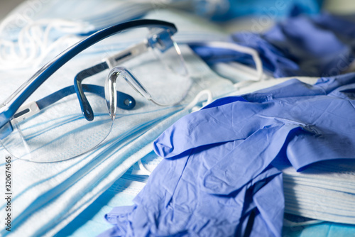 Cuadros en Lienzo Pair of Safety Glasses, Masks And Gloves To Prevent The Spread Of Infection