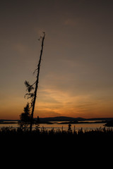 Canvas Print - landscape of a sunset. Lake Manicouagan in Quebec. Mountain landscape with lake