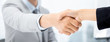 © Atstock Productions - Businesspeople making handshake at meeting room on banner background