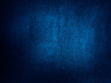 Abstract Blue Background. Dark Blue Grunge Background. Rough Grainy Concrete Wall Surface Texture. Deep Blue Concrete Backdrop.