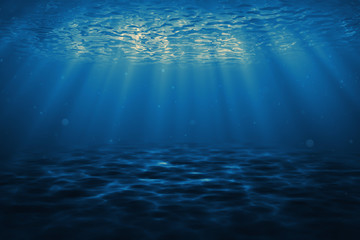 Wall Mural - Dark blue ocean surface seen from underwater. Abstract waves underwater and rays of sunlight shining through. 3D illustration