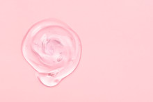 Clear Gel Drop Or Smear Isolated On Pink Background.