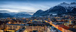 canvas print picture - Panorama der Skyline von Innsbruck, Alpen, Österreich, im Winter am Abend mit schneebedeckten Bergen im Hintergrund