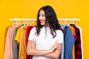 Wall Mural - Mixed race woman in a clothing store looking to the side