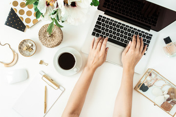 Wall Mural - Woman hands work on laptop. Home office desk table workspace with laptop on white background. Flat lay, top view freelance work concept.