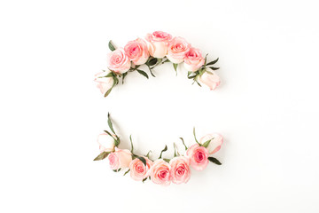 Wall Mural - Round frame border of pink rose flower buds on white background. Mockup blank copy space. Flat lay, top view floral composition.