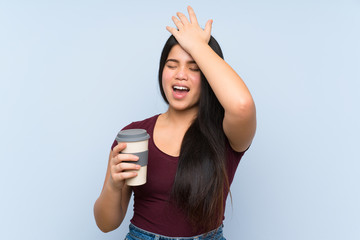 Wall Mural - Young teenager Asian girl holding a take away coffee has realized something and intending the solution