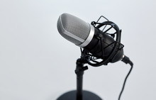 Technology And Audio Equipment Concept - Close Up Of Microphone On White Background