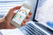 © NicoElNino - Credit Report with Score rating app on smartphone screen showing creditworthiness of a person for loan and mortgage application based on payment history and debt usage, budget management performance