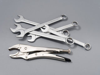 auto repair wrenches on a gray background