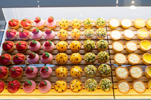 Top View Image Of Fruit Pies Being Displayed On A Transparent Storage.