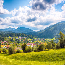 Stunning Alpine Landscape With Green Fields And Piatra Craiului Mountains In Dambovicioara Commune