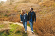 Image of beautiful couple dating and walking together in countryside