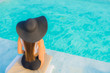 © siraphol - Portrait beautiful young asian woman happy smile relax around outdoor swimming pool in hotel resort