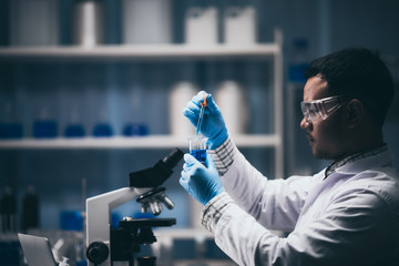 Wall Mural - team of medical research scientists collectively working on a new generation experimental drug treat
