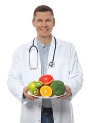 Nutritionist with healthy products on white background