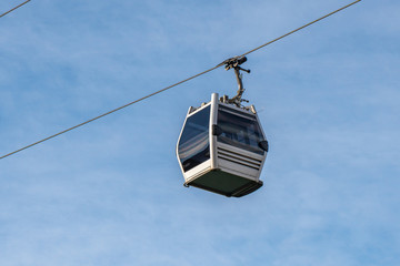 View of cableway gondola cable car on blue sky background