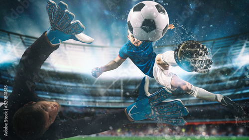 Fotografía Soccer striker hits the ball with an acrobatic kick in the air at the stadium at