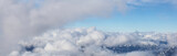 Fototapeta Mapy - Beautiful View of the Cloudscape over the Canadian Mountain Landscape during a sunny and cloudy winter day. Taken in Whistler, BC, Canada. Good for Background, Backdrop