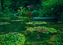 The Lilypond With The Flowering Water Lillies At Claude Monet’s Garden