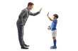 © Ljupco Smokovski - Boy with a soccer ball gesturing high five with a man