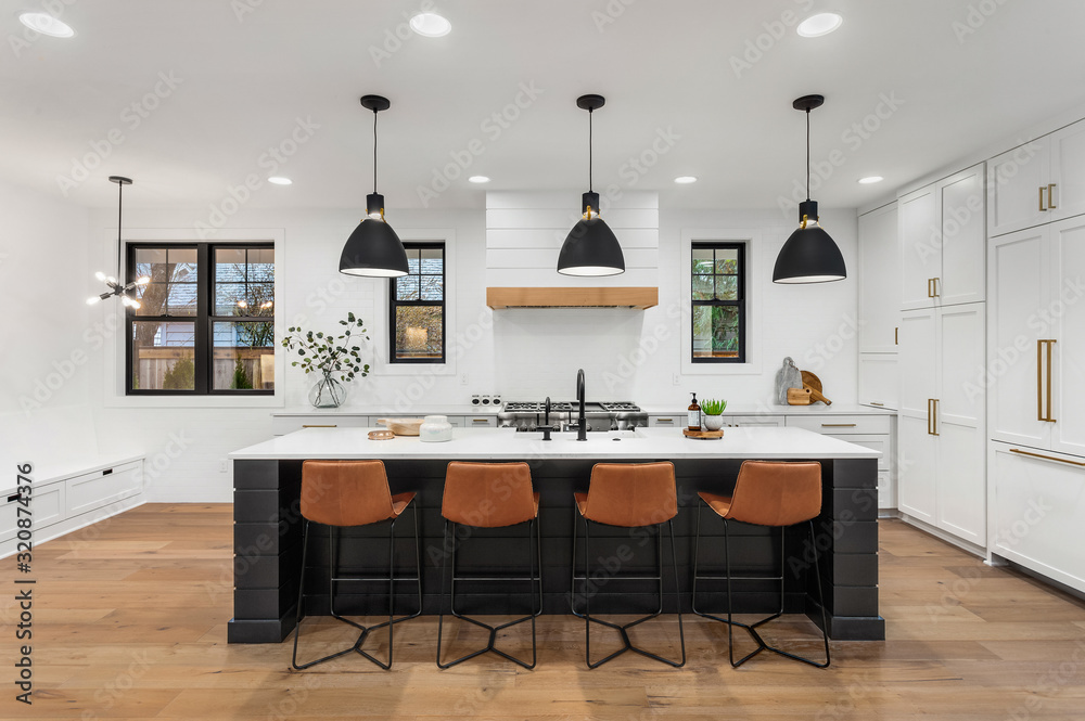 Obraz na płótnie Beautiful white kitchen with dark accents in new modern farmhouse style luxury home w salonie