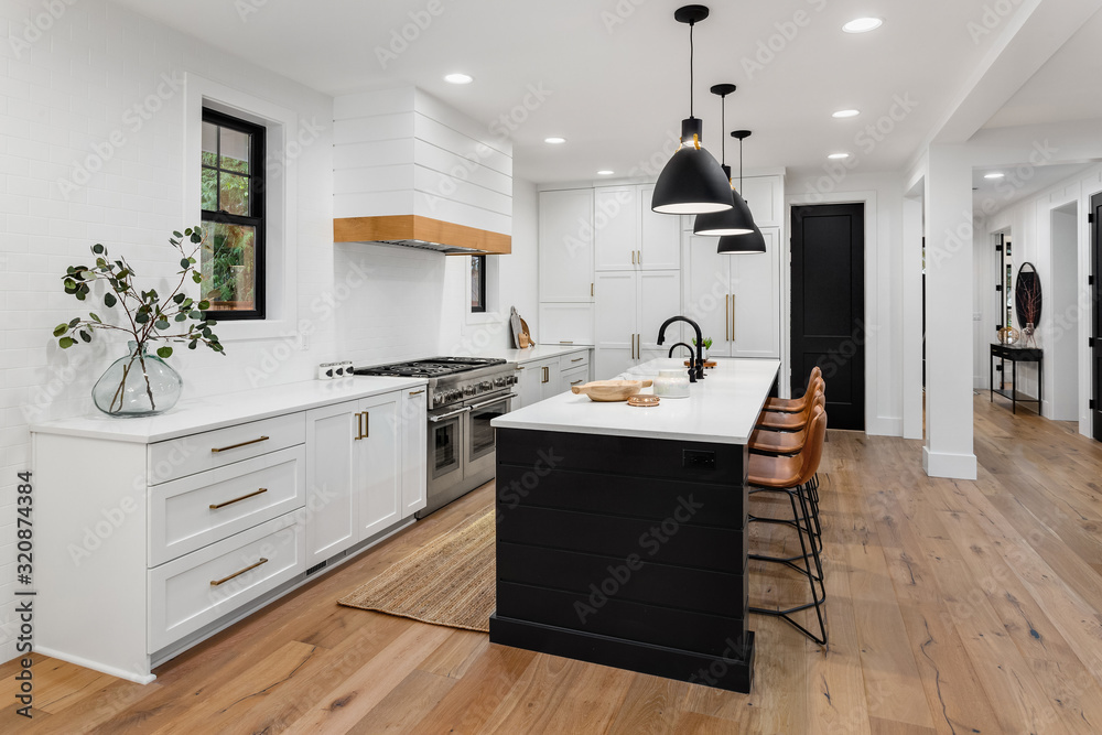 Beautiful white kitchen with dark accents in new modern farmhouse style luxury home - obrazy, fototapety, plakaty 