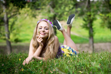 Girl in the grass with a funny expression.