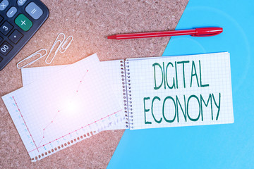 Poster - Handwriting text writing Digital Economy. Conceptual photo economic activities that are based on digital technologies Desk notebook paper office cardboard paperboard study supplies table chart