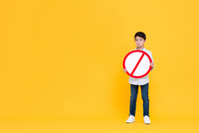 Sad Young Asian Boy Holding Red Ban Signage