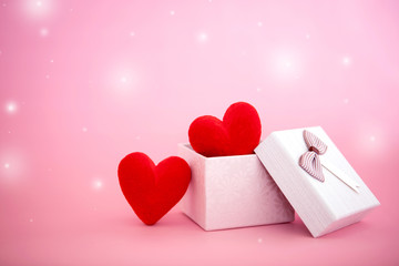 The red Heart shapes  in gift box on sweet pink background , the love concept for valentines day with sweet and romantic moment