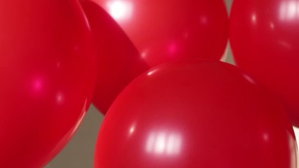 Wall Mural - red helium balloons on beige background