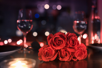 Wall Mural - Beautiful romantic dinner date night setting with roses and wine