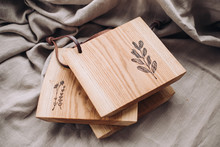 Wooden сutting Board Engraved With Botanical Pictures, Wood Board On Linen Surface 