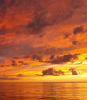 Orange coloured stratocumulus cloudy coastal Sunset Seascape. Australia