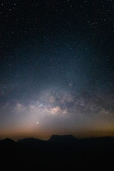 Wall Mural - milky way with night landscape silhouettes mountain
