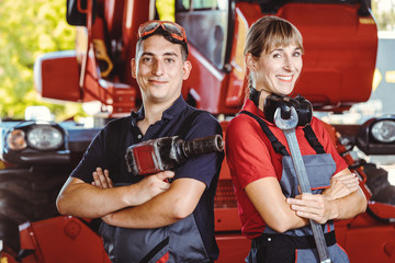 Two machinists for farm machinery in their garage