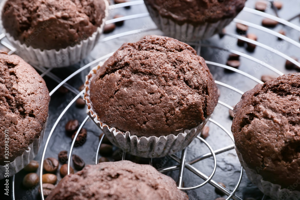 Tasty chocolate muffins on dark background