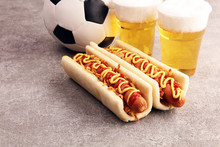 Grilled Hot Dogs With Mustard And Ketchup On The Table With Draft Beer For Football Soccer Party Time